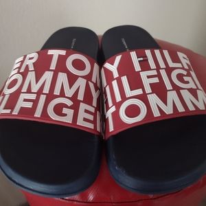 Foam/thick rubber, raised letter, red & blueTommy Hilfiger pool slides. Unisex